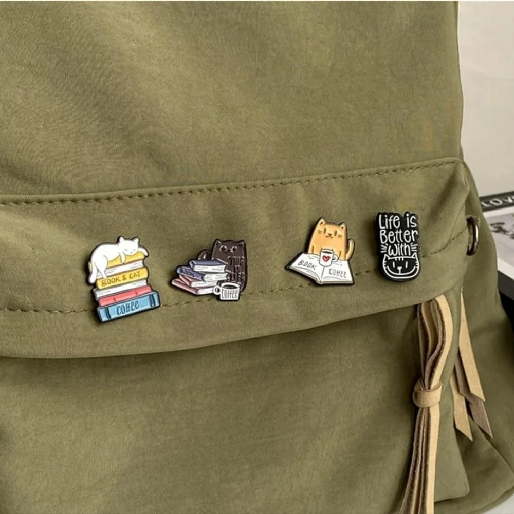 Women’s Jewelry Adorable Multicolored Cat Pins and some feature books and cups